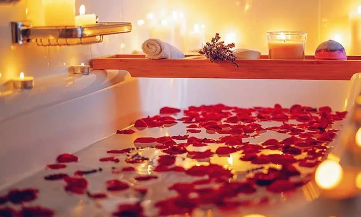 bathtub filled with rose petals
