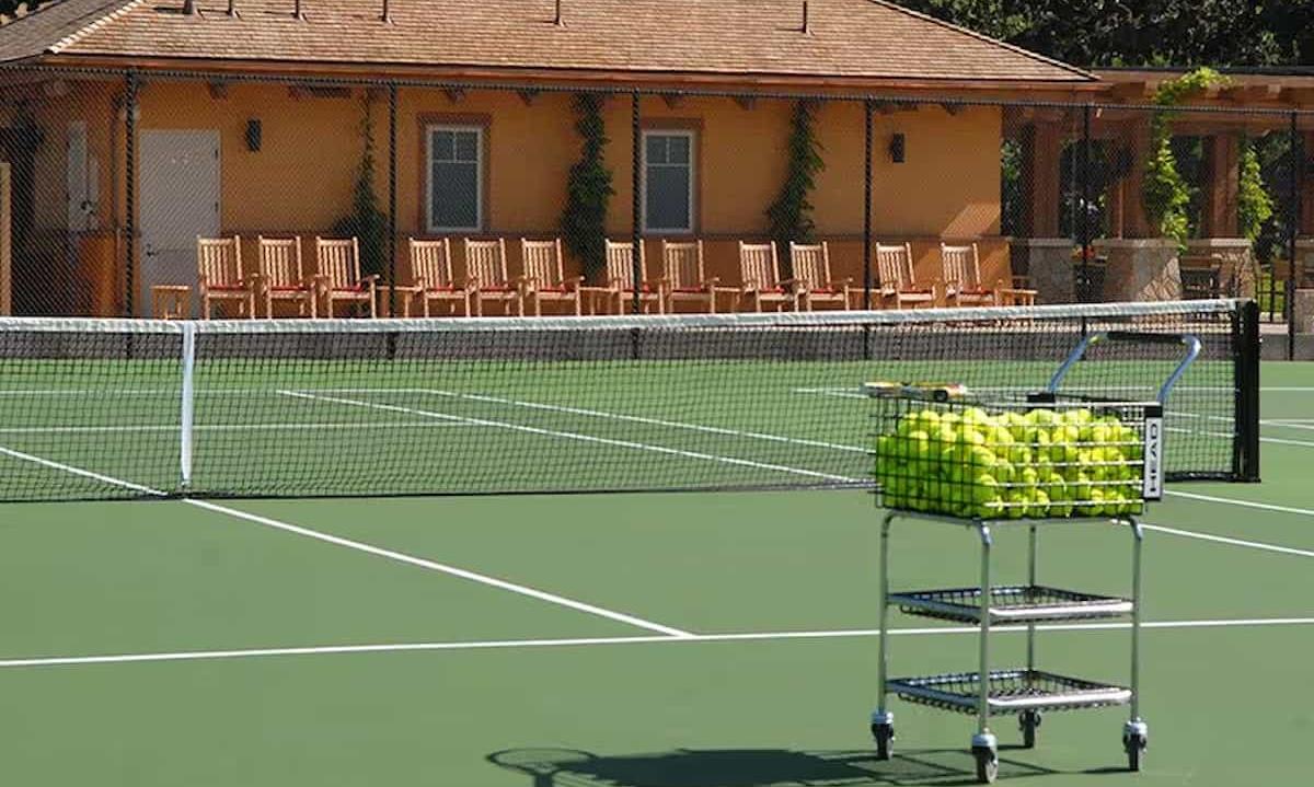 tennis court with tennis ball basket