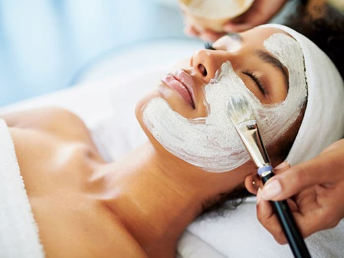 woman getting facial at spa